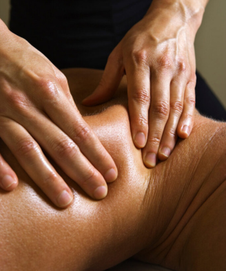 Massage therapist giving a deep tissue massage