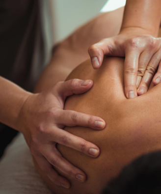 Customer receiving a therapeutic massage from a massage therapist in Brassall